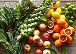 a group of fruits and vegetables on a wood surface Healthy Weight Loss Diets Glossop