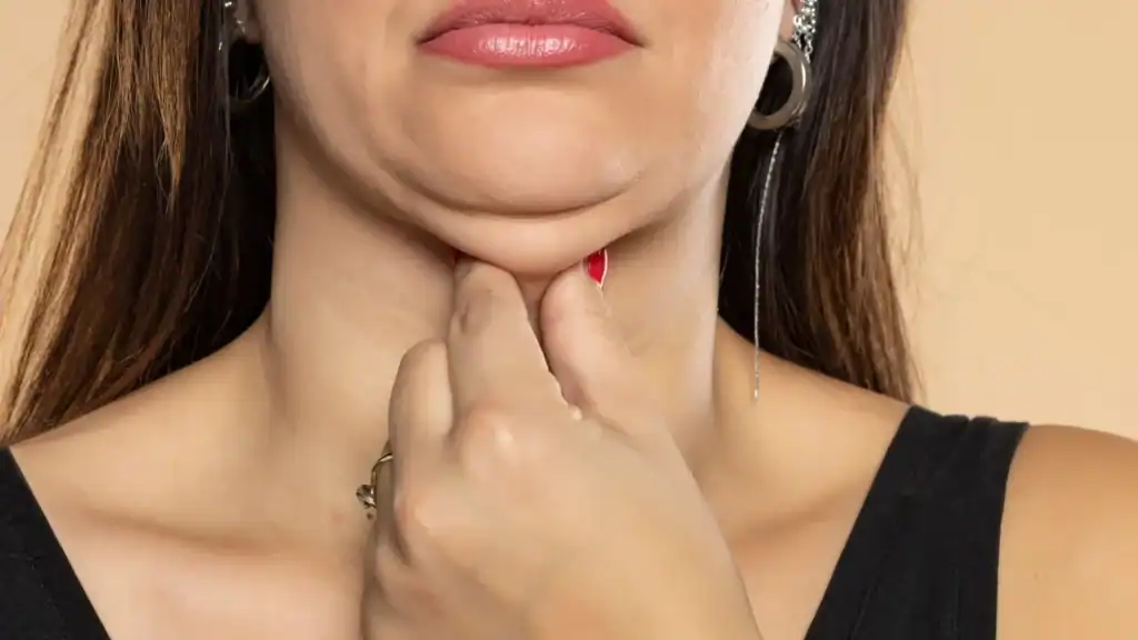 An image of a woman with double chin, sad, worried : Non Surgical Double Chin Removal Treatment in Glossop, UK